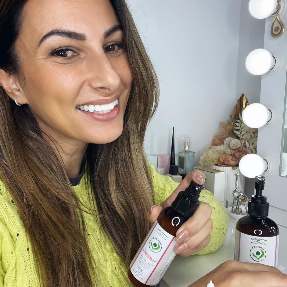 Woman holding Organic Formulations Lavender Hand Wash 